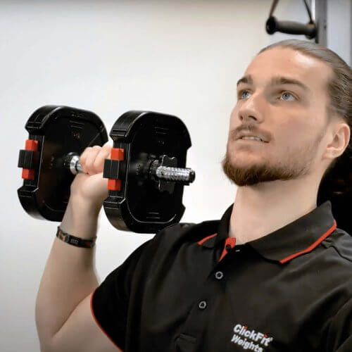 A person using a ClickFit Dumbbell during exercises at the gym